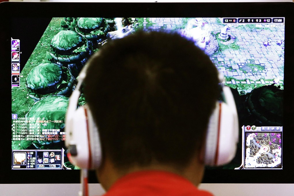 A man plays a computer game at an internet cafe in Beijing. Photo: Reuters