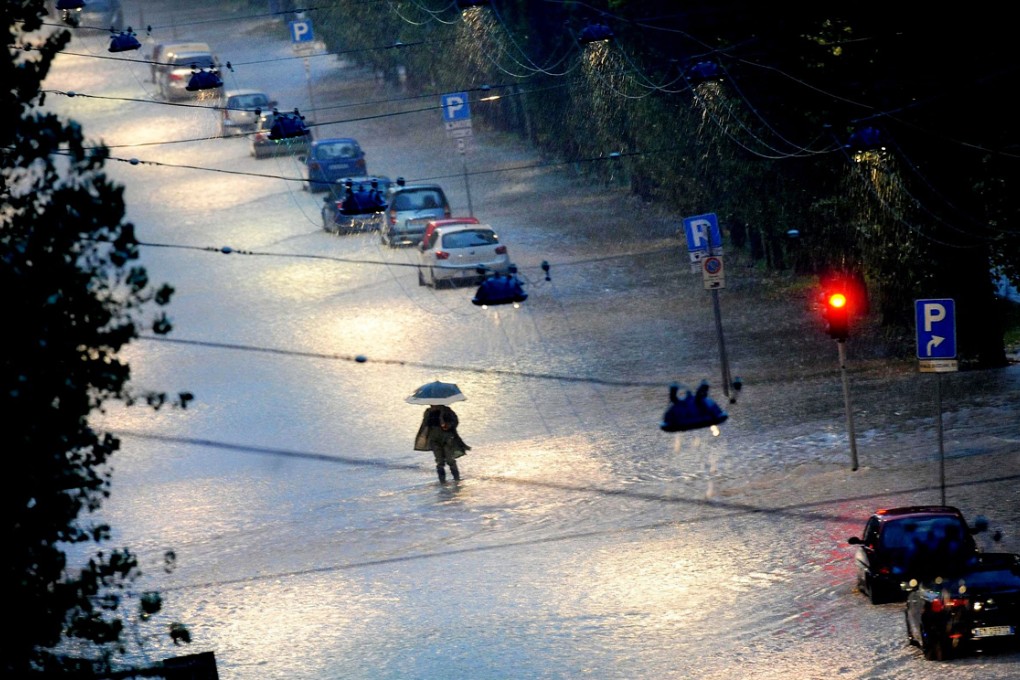 A flooded street in Milan, Italy. Photo: EPA