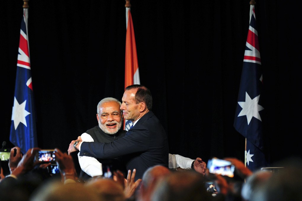 India's Prime Minister Narendra Modi (left) is hugged by Australia's Prime Minister Tony Abbott during a reception in Melbourne. Photo: Reuters