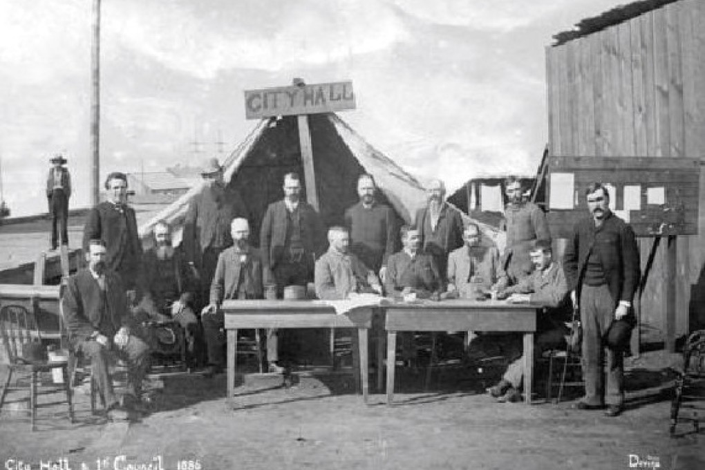 A meeting of Vancouver’s council in 1886, after the city had been razed by fire. Mayor Malcolm MacLean is seated fourth from right. Photo: City of Vancouver Archives