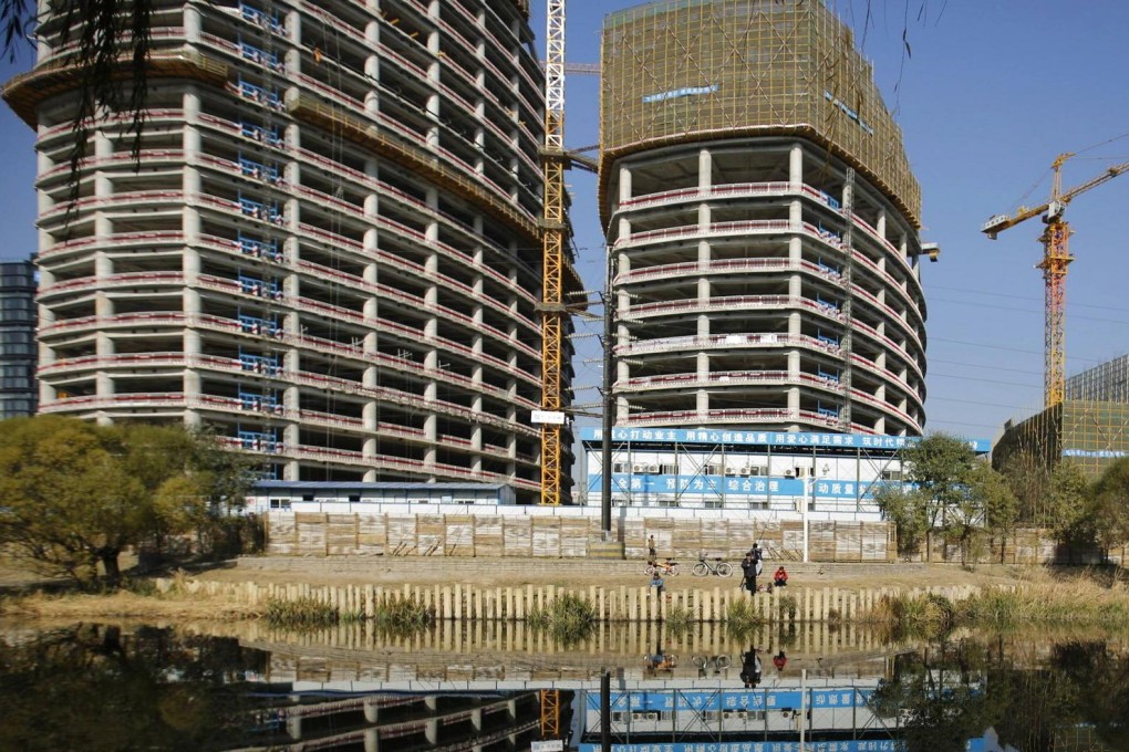 High levels of inventory and tight liquidity are expected to force developers to offer promotions or discounts to speed up sales. Photo: Reuters