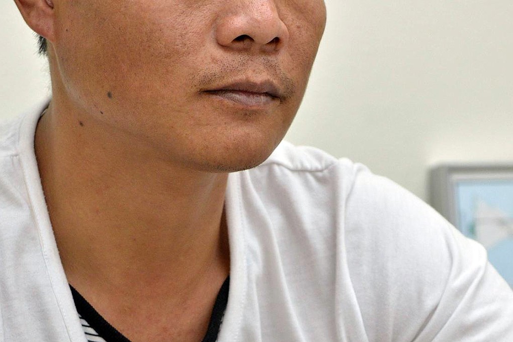 Guest worker Mr En asked not to reveal his full name. Photo: AFP