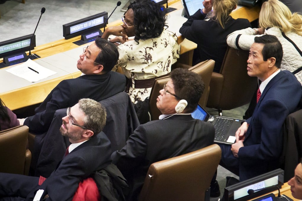 Choe Myong Nam, second from left, North Korea's official in charge of UN affairs and human rights, and other delegates watch the recorded votes on a draft proposal during a meeting of the UN General Assembly human rights committee on Tuesday. Photo: AP