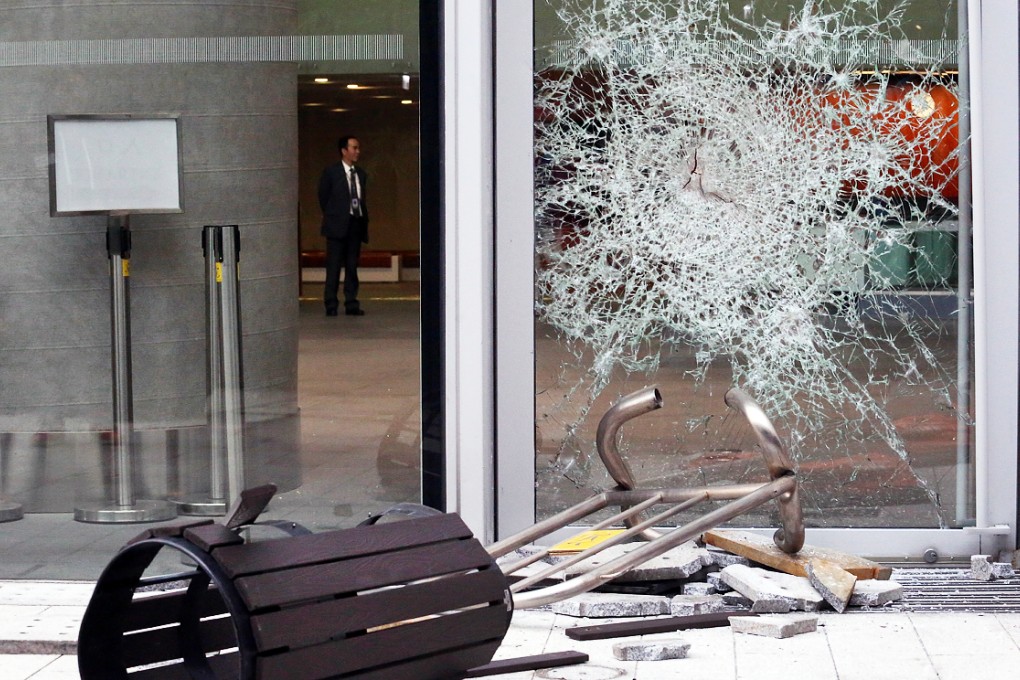 One of the glass doors at the Legislative Council complex that was smashed by masked intruders. Photo: Felix Wong