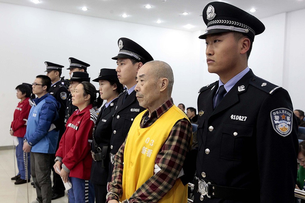 Hu Wanlin on trial at Luoyang Intermediate People's Court, Henan province. Photo: Xinhua