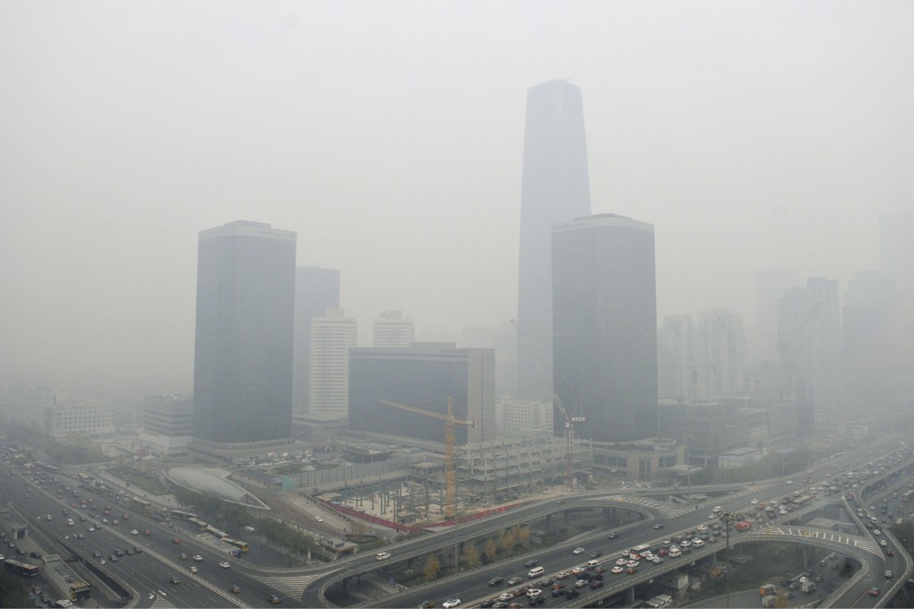 Smog blankets the capital. Planners hope 'wind corridors' could help to disperse the pollution. Photo: Kyodo