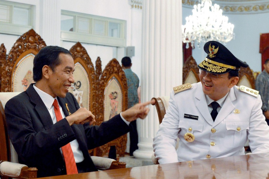 President Joko Widodo (left) with Basuki Tjahaja Purnama, or Ahok, during the Jakarta governor's swearing-in ceremony. Photo: AFP