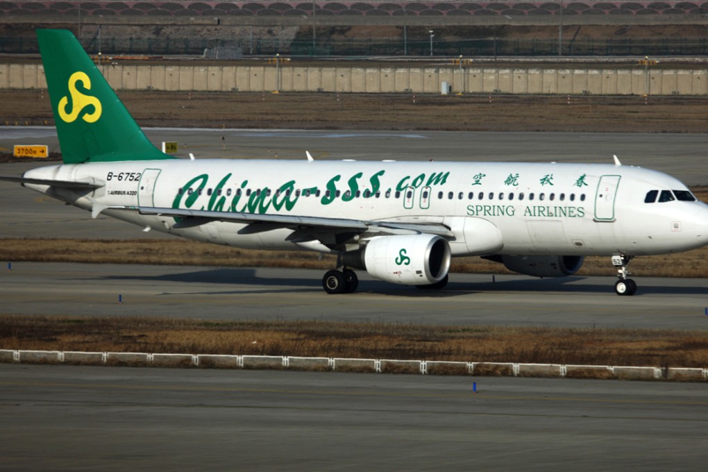China Spring Airlines has paid a total of 87,000 yuan to two passengers with HIV and a volunteer carer after they were not allowed to board a flight in July. Photo: Bloomberg