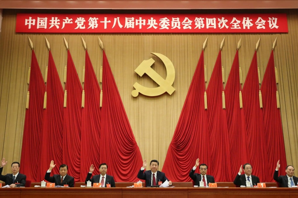 Xi Jinping (centre) at the fourth plenum last month. Photo: Xinhua