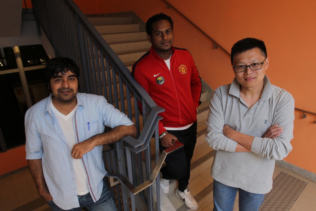 Caritas Francis Hsu College grads Arif Abbas (left) and Jeffrey Andrews (centre) with lecturer Lai Kin-kwok. Photo: May Tse