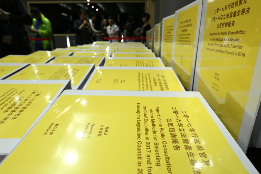 Copies of the report on the consultation of electing the future Hong Kong leader are displayed at a news conference at the Hong Kong government headquarters. Photo: Sam Tsang