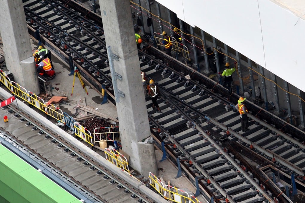 Workers are working at construction site of MTR South Island Line (East) Wong Chuk Hang Station. Photo: Felix Wong