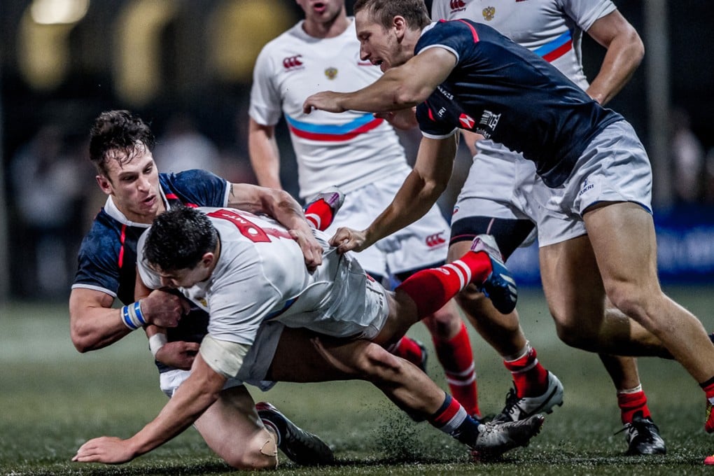 USRC Tigers' new recruit Tyler Spitz (left) makes a tackle for Hong Kong during the second Russia test last Saturday. Photos: HKRFU