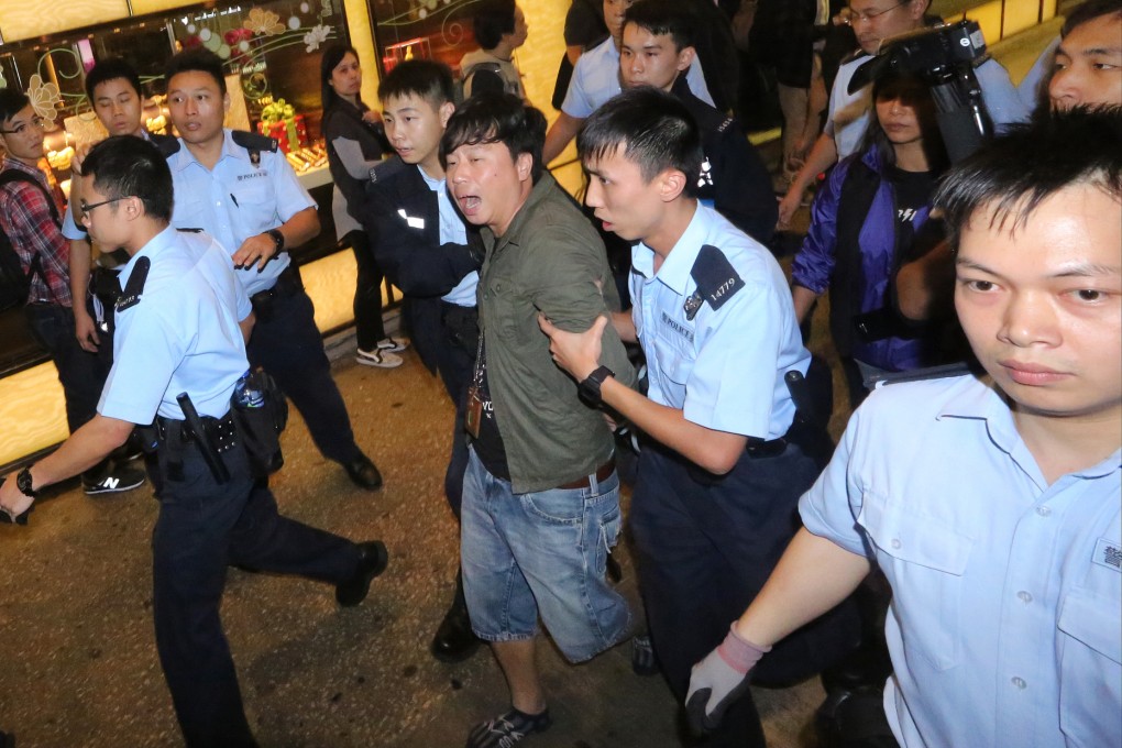 A man takes photos of damaged houses on Sunday after a strong earthquake hit Hakuba in central Japan the night before. Photo: AP