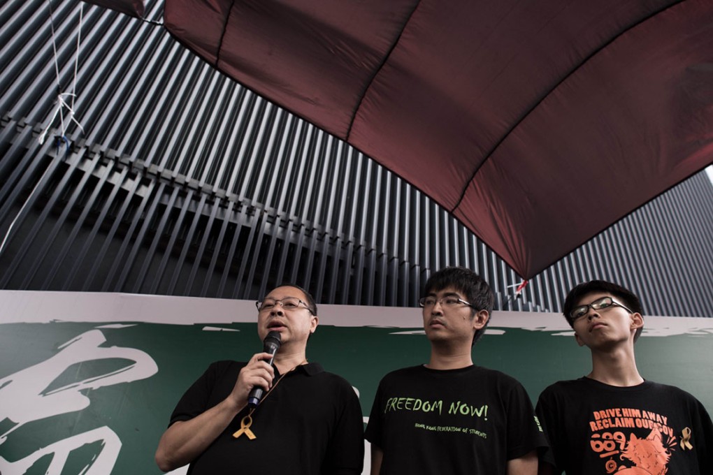 Occupy Central co-founder Benny Tai with Hong Kong student leaders Alex Chow and Joshua Wong. Occupy volunteers, students and pan-democrat lawmakers will be stationed at 21 locations across the city to share their views on universal suffrage.