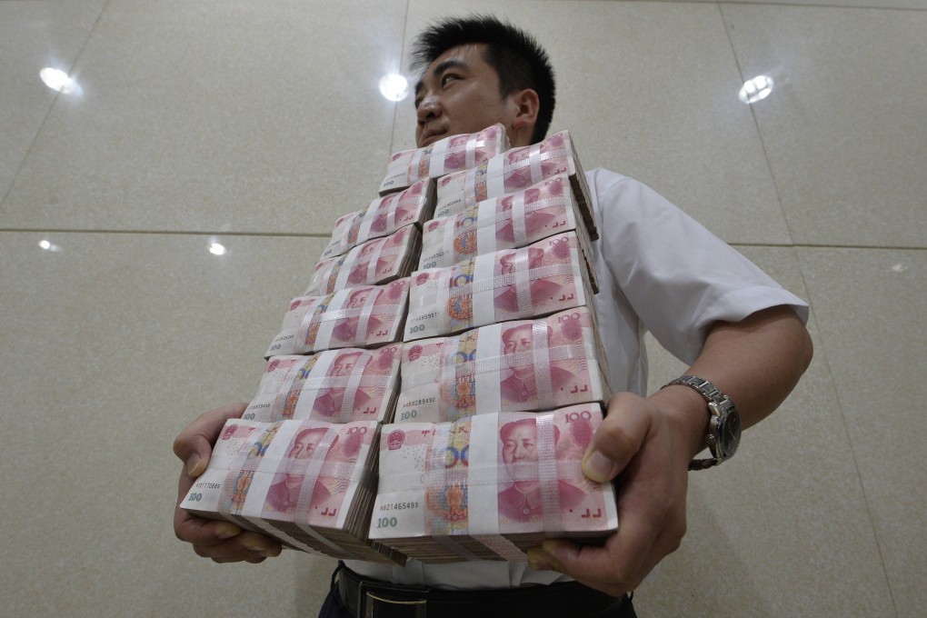 An employee carries bundles of Chinese bank notes. China's curbs on 'shadow banking' may make it difficult for small companies to raise funds in the coming months. Photo: Reuters