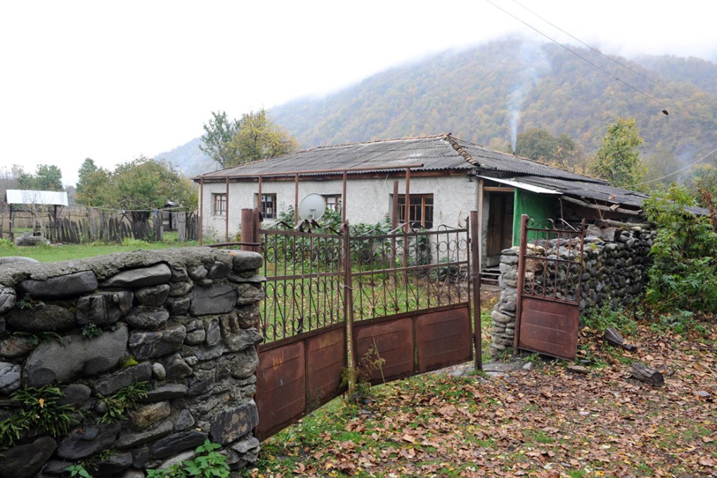 White smoke belches from the chimney of a lopsided stone house, mingling with thick fog in Georgia's Pankisi Gorge whose bucolic setting hardly fits its reputation as a jihadist hotbed. Photo: AFP