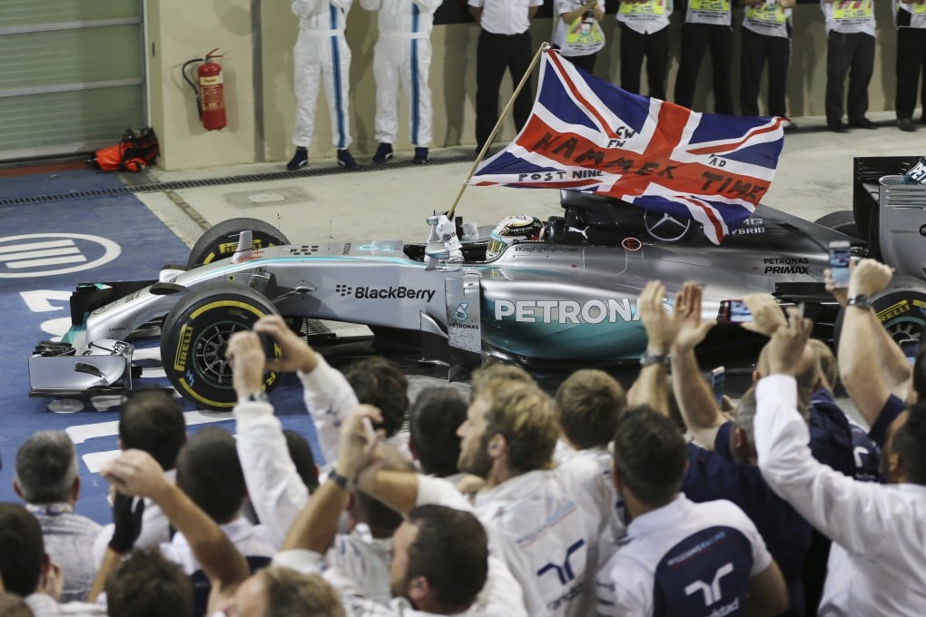 Mercedes' Lewis Hamilton celebrates winning the Abu Dhabi Grand Prix to clinch the Formula One world championship. Photo: AP
