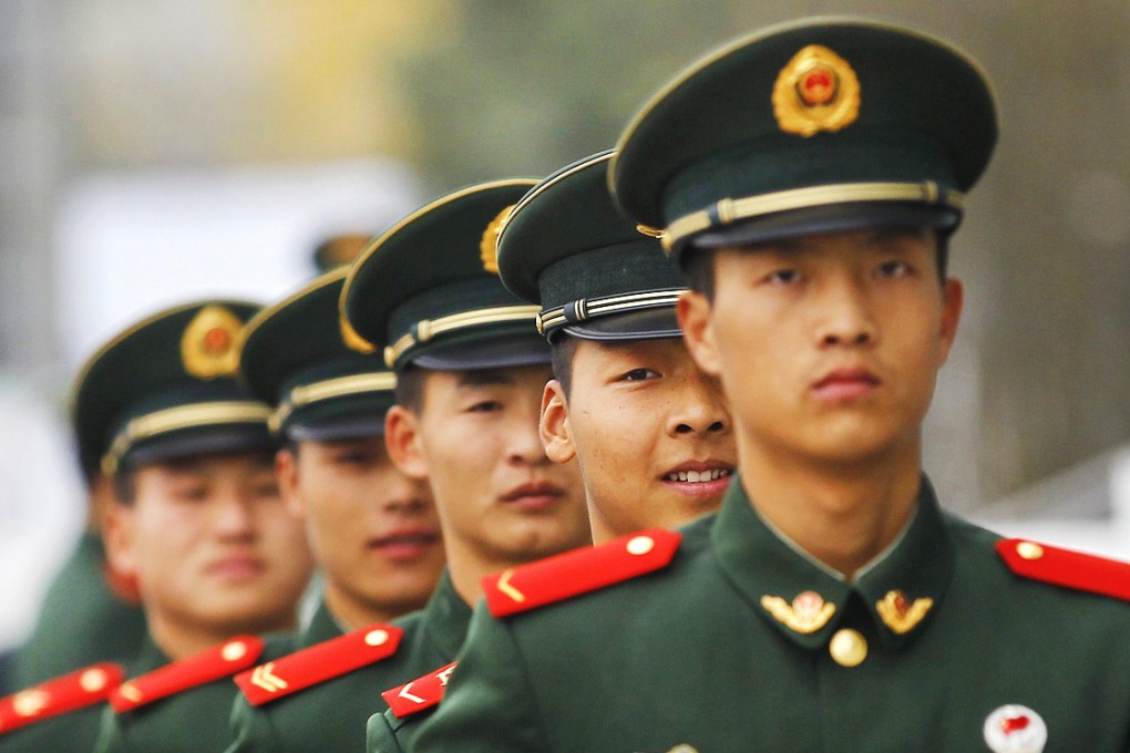 Officers in the People's Liberation Army who want career advancement must prove their loyalty to the Communist Party. Photo: EPA
