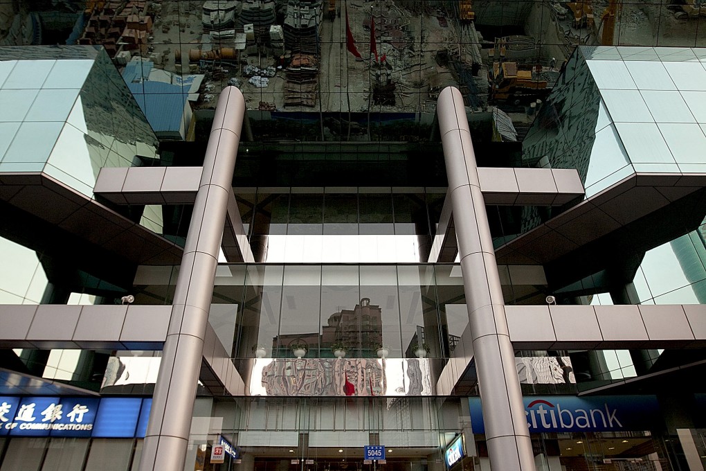 The Shenzhen Stock Exchange building stands in Guangdong province. Shares of GF Securities, one of China's largest brokerage firms, were suspended after hitting the 10 percent daily limit. Photo: Bloomberg