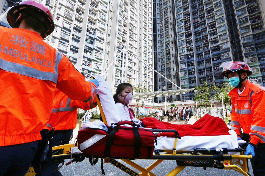 An injured is taken to hospital after a gas explosion in Shek Kip Mei. Photo: SCMP