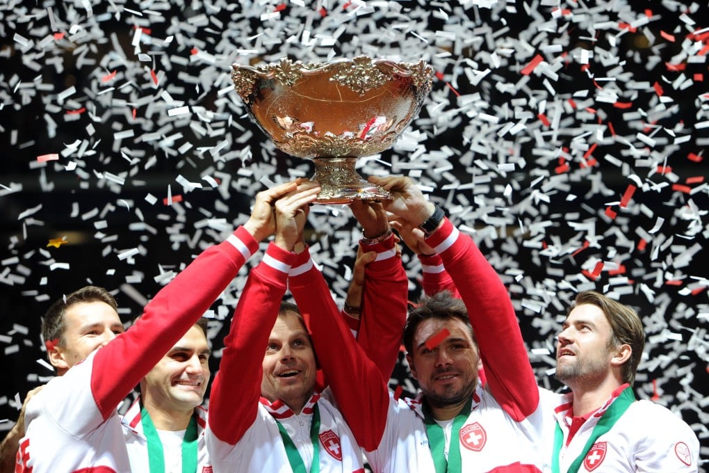 Switzerland (from left) Marco Chiudinelli, Roger Federer, team captain Severin Luthi, Stanislas Wawrinka and Michael Lammer celebrate after winning the Davis Cup final against France. Photo: AFP