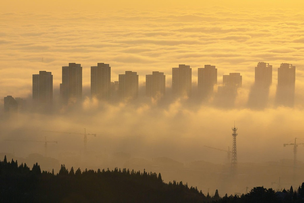 Clouds surround buildings in Ji county in Tianjin at sunrise yesterday. Weather conditions are expected to worsen air quality in the municipality today. Photo: Xinhua