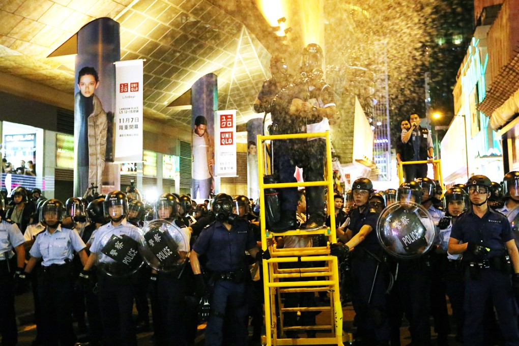 Police fire at protesters with tear spray. Photo: Sam Tsang