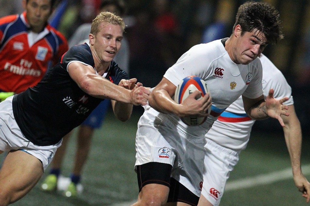 Hong Kong’s Max Woodward gets to grips with Russia’s German Davydov during the second Ustinov Cup test on November 15. Photo: Edward Wong/SCMP