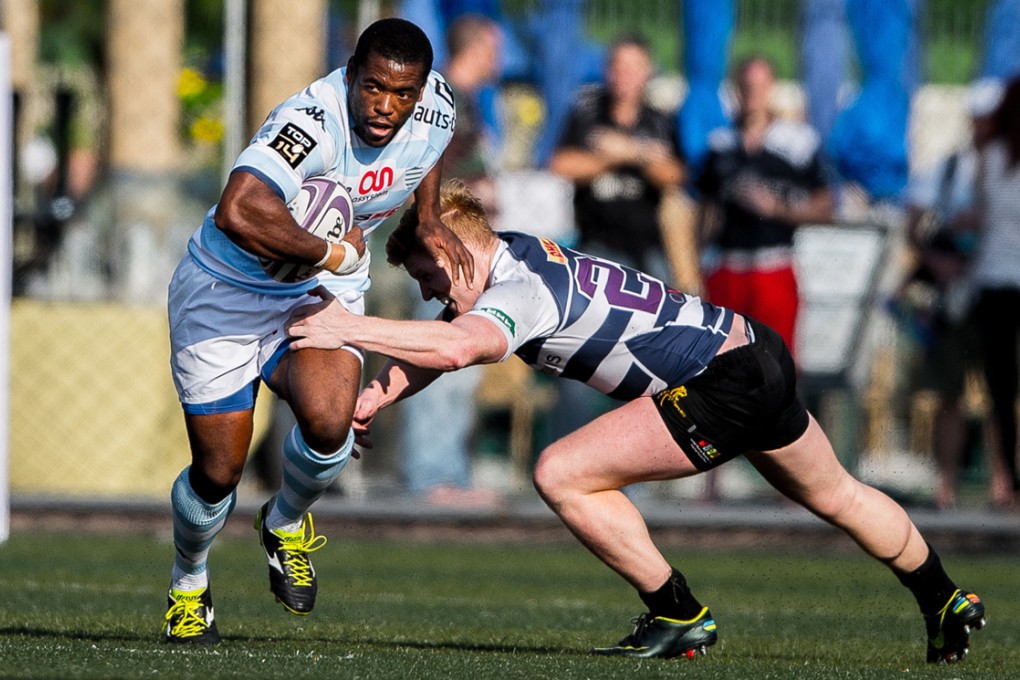 Racing Métro prop Brian Mujati (left) on the charge during the Natixis Cup. Mujati and two fellow Springboks dropped by a special screening of “Invictus” where they answered Hong Kong school students’ questions about the game. Photos: HKRFU