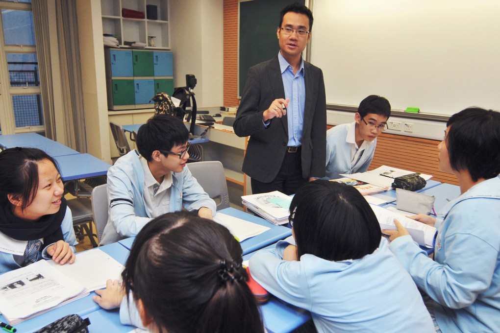 Liberal Studies teacher Lee Wai-kim giving after-school lesson for S6 students who are preparing for Hong Kong Diploma of Secondary Education examination at Hong Kong Baptist University Affiliated School Wong Kam Fai Secondary and Primary School. 09NOV11