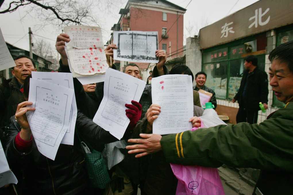 Petitioners voice grievances outside a supreme court office in Beijing. Photo: AP