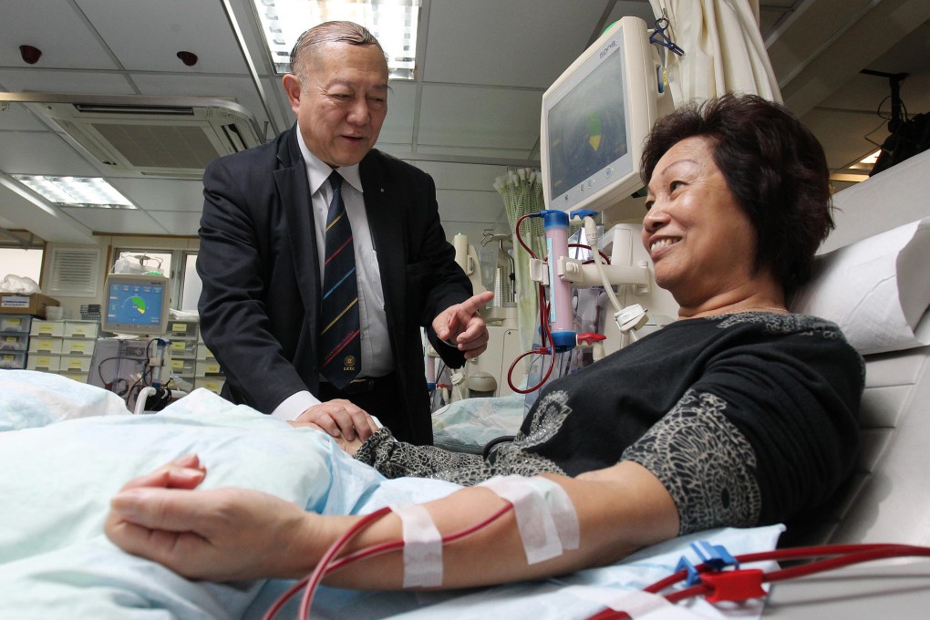 Timothy Teoh (left), founding chairman of Lions Kidney Educational Centre and Research Foundation, visits patient Ma Suk-lan in Sham Shui Po. Photo: May Tse
