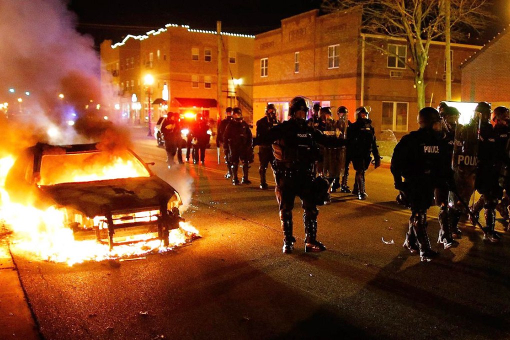 Cars and buildings were torched in Ferguson, Missouri. Photo: EPA