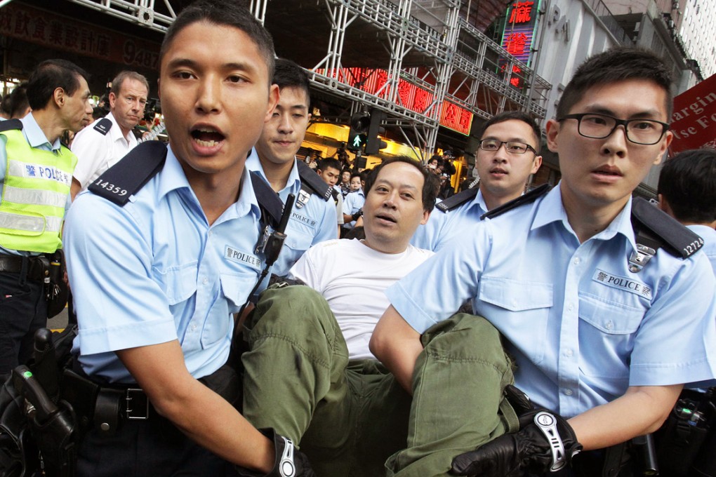 A protester is carried away by police in Mong Kok. Photo: Dickson Lee