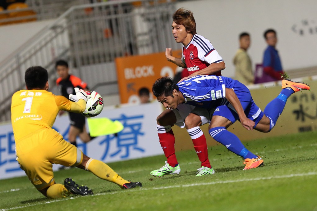 Eastern's Lee Chi-ho heads the ball back to keeper Yapp Hung-fai ahead of South China's Lee Wai-lim in their clash at Mong Kok Stadium. South China won 2-1. Photo: Nora Tam