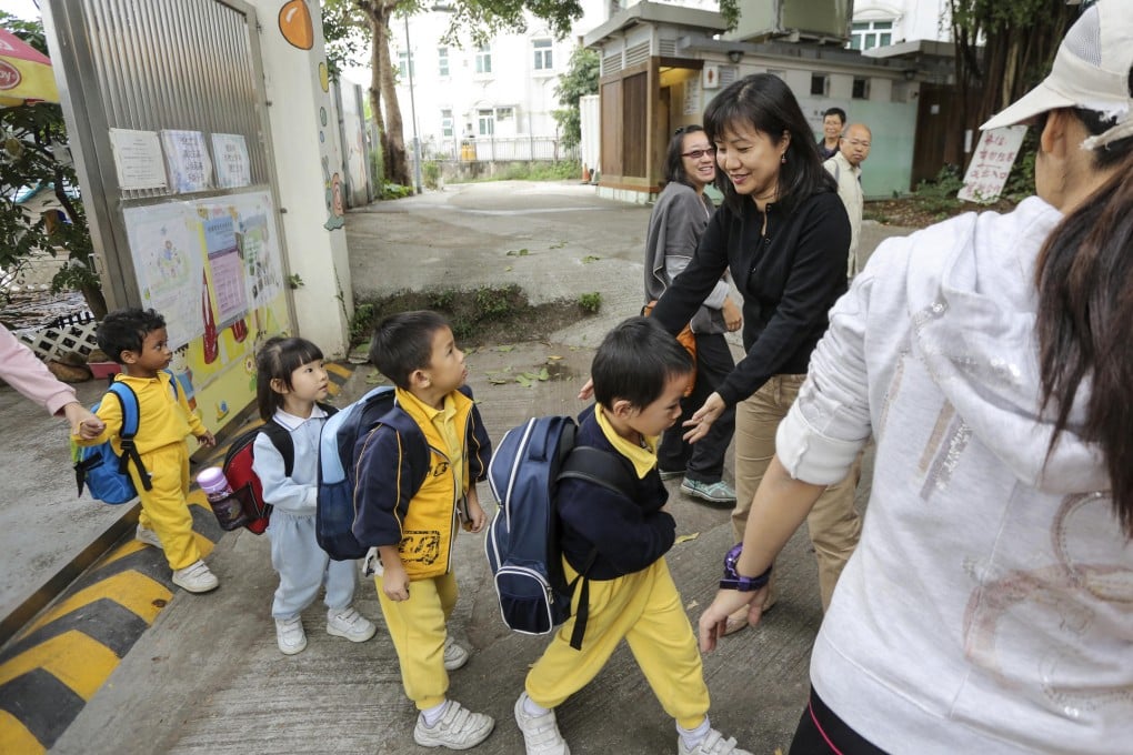 Lilian Lui (in black shirt) says she took over Yuen Kong Kindergarten because the five students needed a place to learn.
