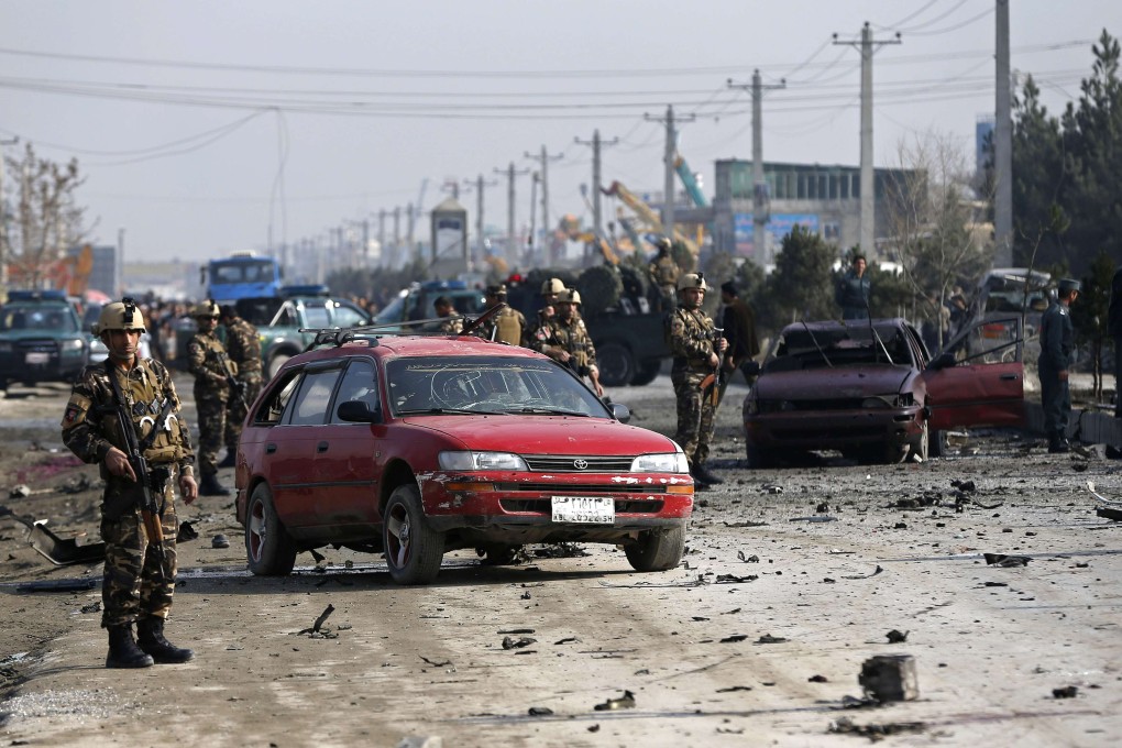 Afghan security forces inspect the site of a suicide attack in Kabul. Photo: Reuters
