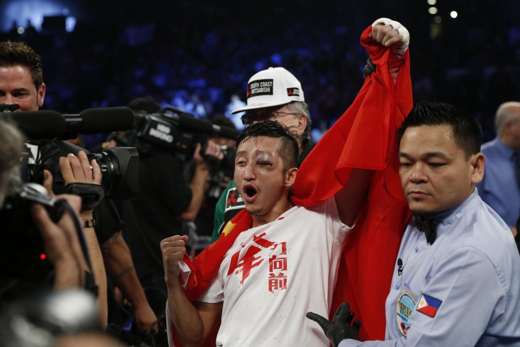 Zou Shiming won the fight despite his injury. Photo: AP