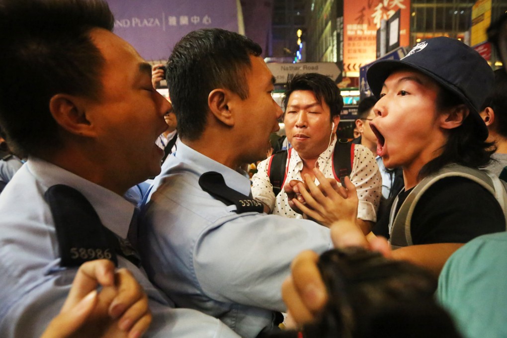Protesters and police clash in Mong Kok. Photo: Felix Wong