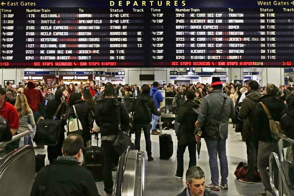 Holiday travellers wait for trains in New York. Photo: EPA