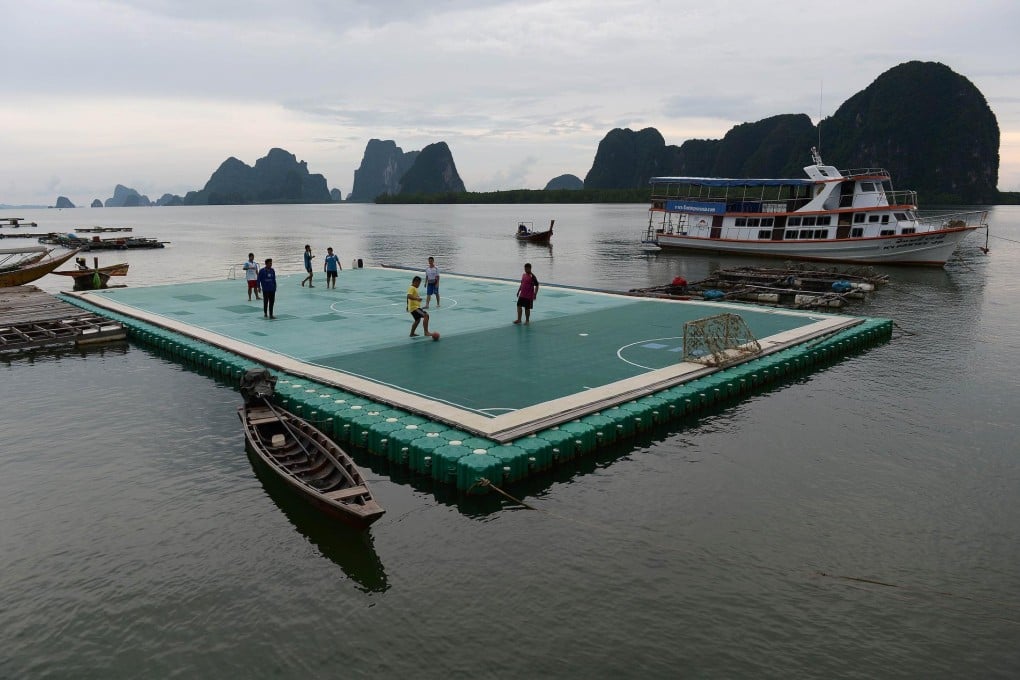 Youngsters take to the soccer pitch on the Thai island of Panyee in picturesque Phanga Nga province. Photo: AFP