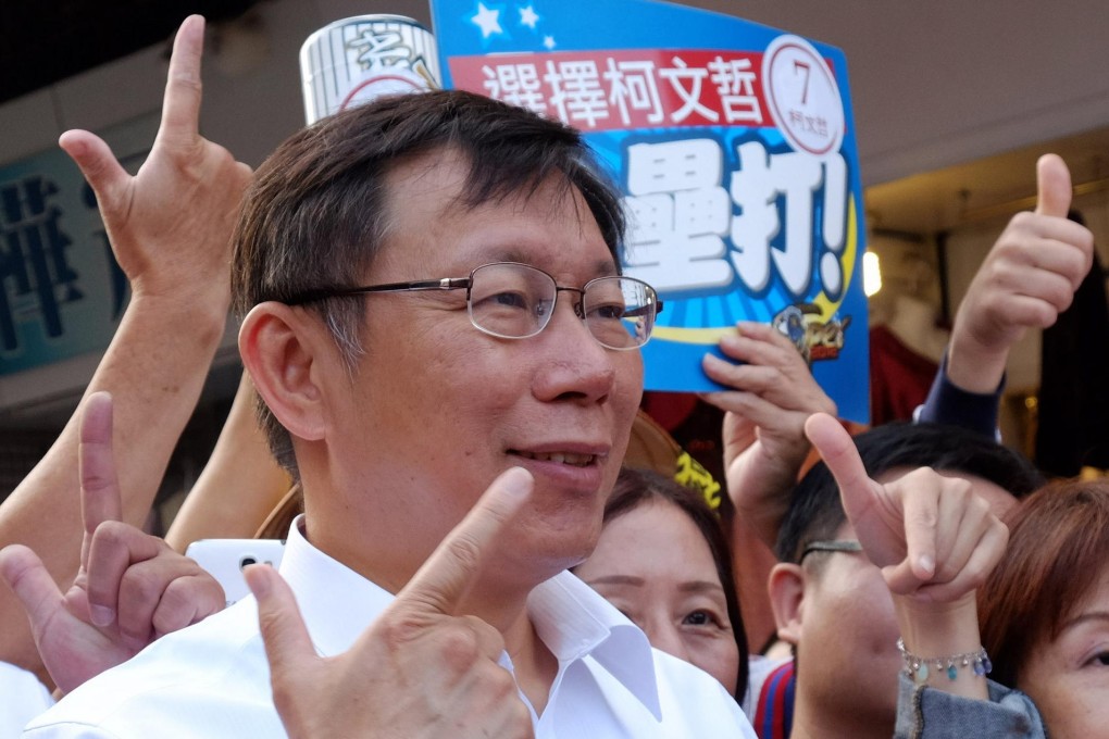 Independent candidate Ko Wen-je, seen here campaigning in the capital, is expected to beat his KMT rival to the mayoralty. Photo: AFP