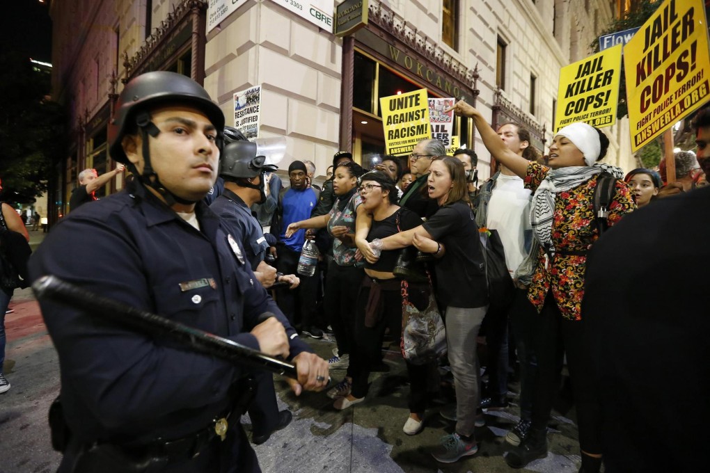 Police face off against protesters in Los Angeles. Photo: Reuters