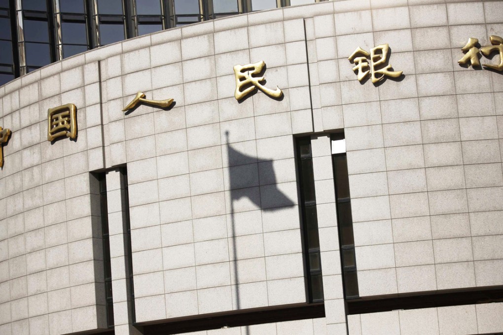 A Chinese flag flutters outside the headquarters of the People's Bank of China, the country's central bank which refrained from open market operations for the first time in four month. Photo: Reuters