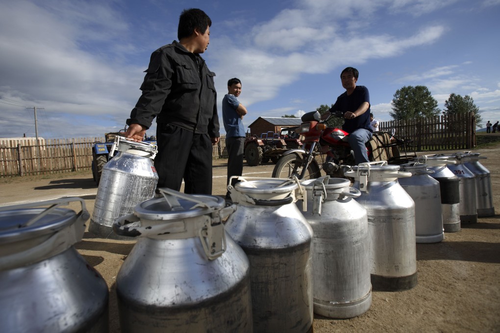 Dairy farmers deliver fresh milk in China. RRJ Capital and China's Bright Dairy and Food said they plan to list their joint venture which will help expand its dairy operations in the country. Photo: Bloomberg