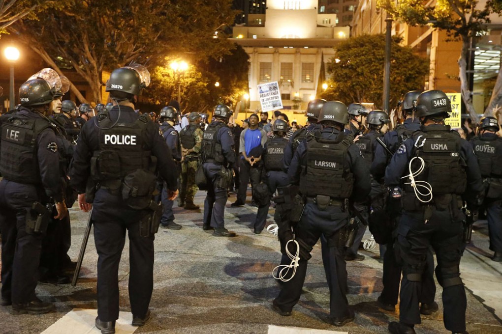 Police corral protesters before detaining them during a march in Los Angeles.