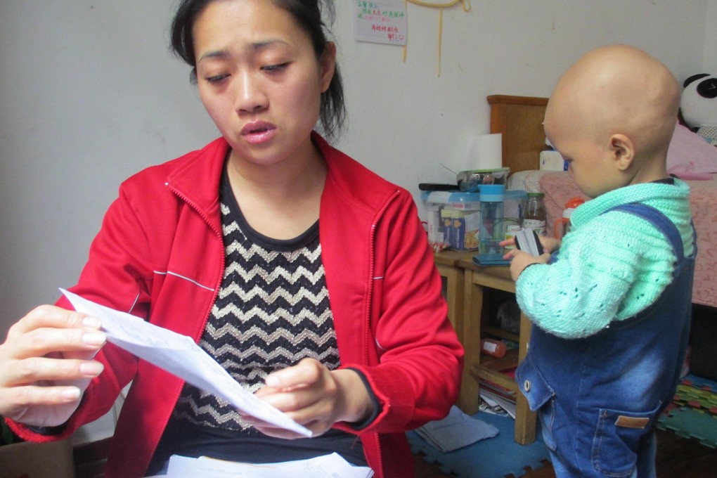 Feeling the strain: Wang Tao says medical bills for Sun Mohang, who is nearly three, have reached about 200,000 yuan. Photo: Alice Yan