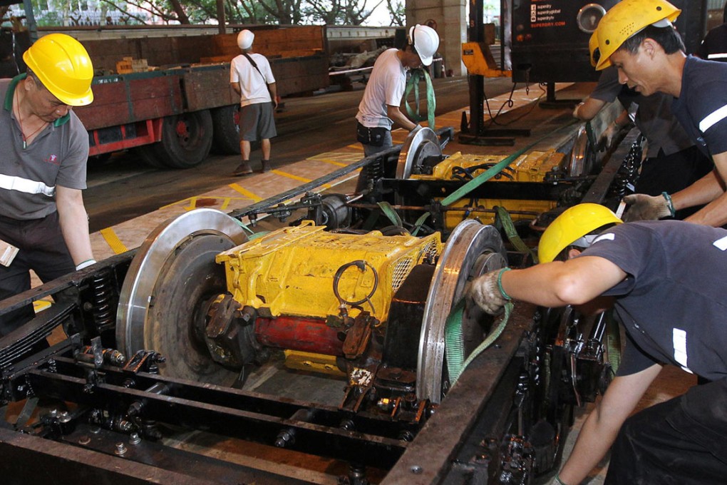 Hong Kong Tramways staff repair and maintain the vehicles at the Sai Wan Ho tram depot. Photo: Edward Wong