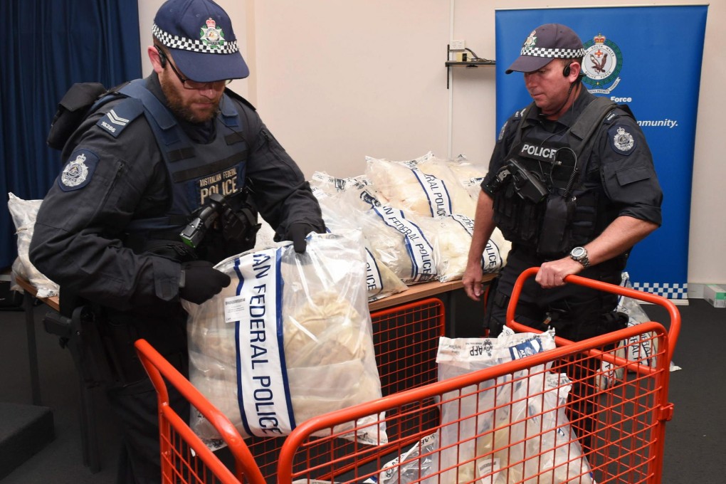 Australian police handle seized drugs yesterday. Photo: AFP